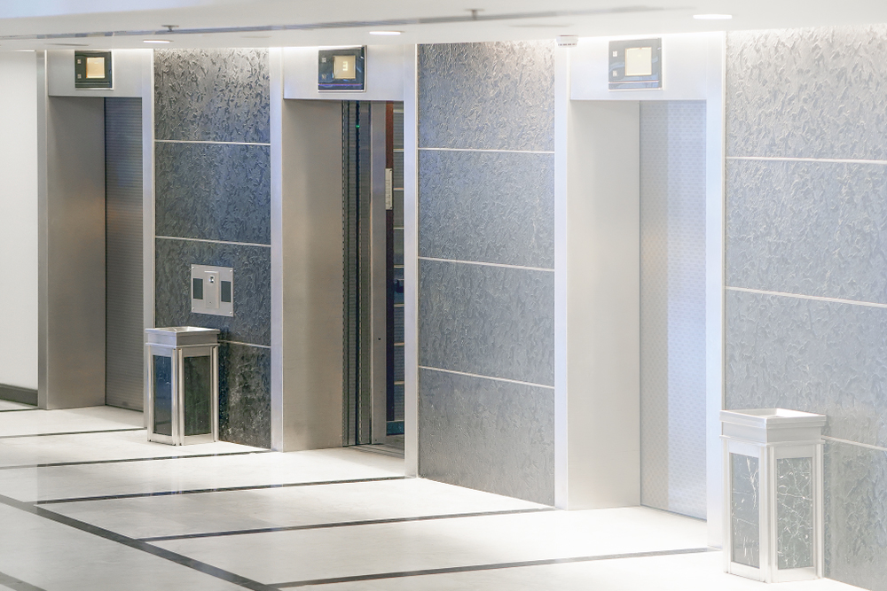 Three elevator doors in office building. Wide angle view of modern elevators with doors. Elevators in the modern lobby house or hotel.                               ; Shutterstock ID 1626707566; Purchase Order: purchase_order